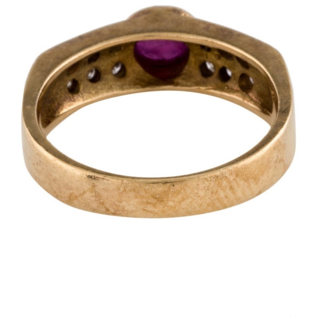 Cabochon Ruby ring set with diamond stones set in an 18 karat gold band