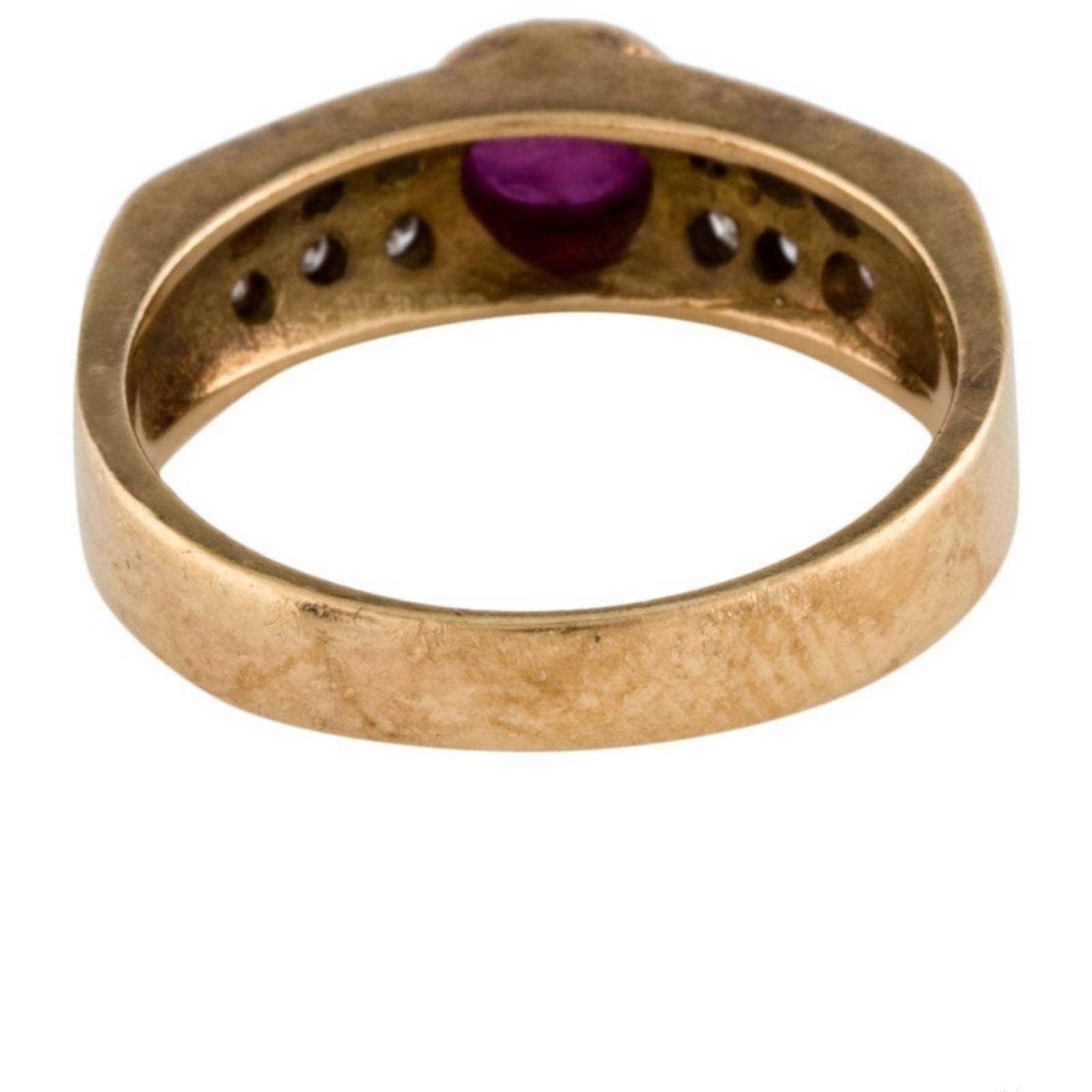 Cabochon Ruby ring set with diamond stones set in an 18 karat gold band