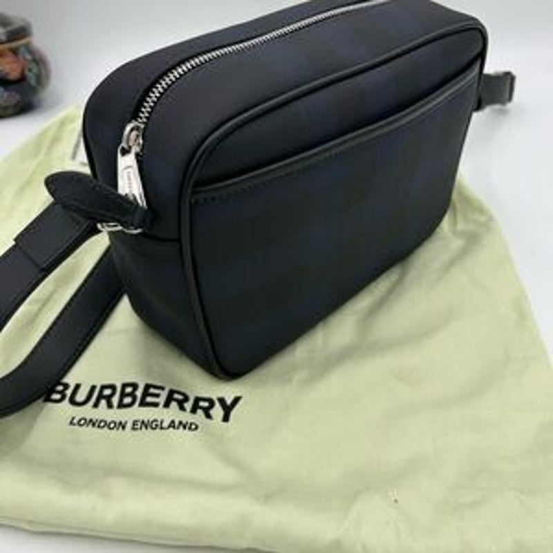 Men's Burberry, check messenger bag in navy blue. Adjustable shoulder strap.