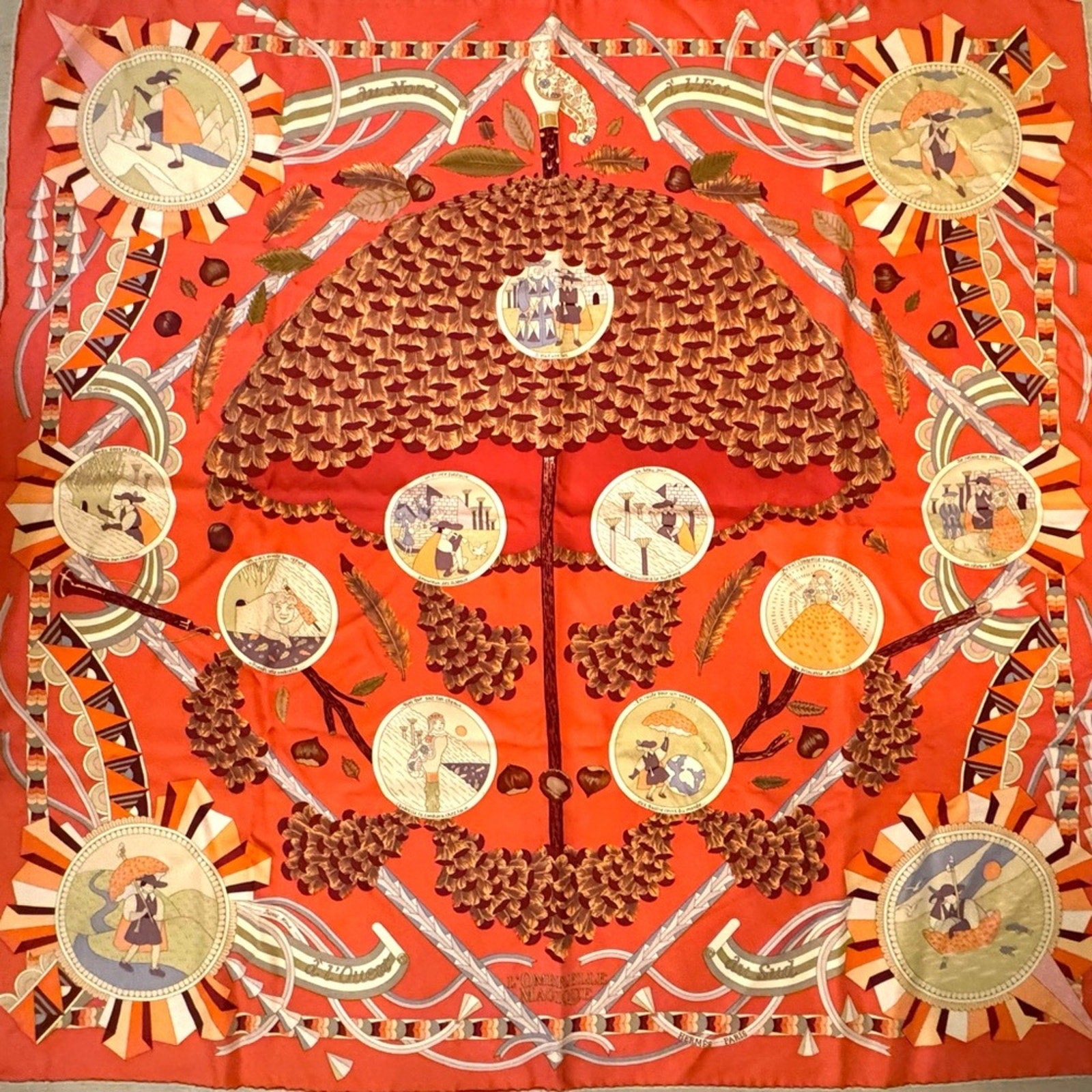 Hermes, silk scarf. The theme is the magic umbrella, coral colorway w/vignettes.