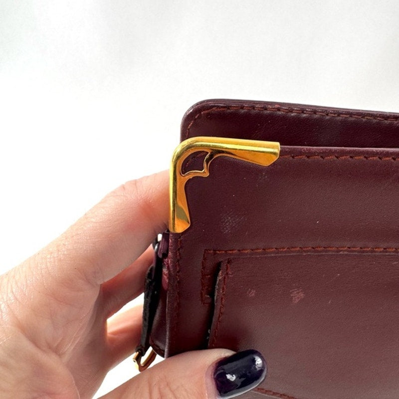Cartier Burgundy Wristlet pouch with exterior front pocket w/interior peeling