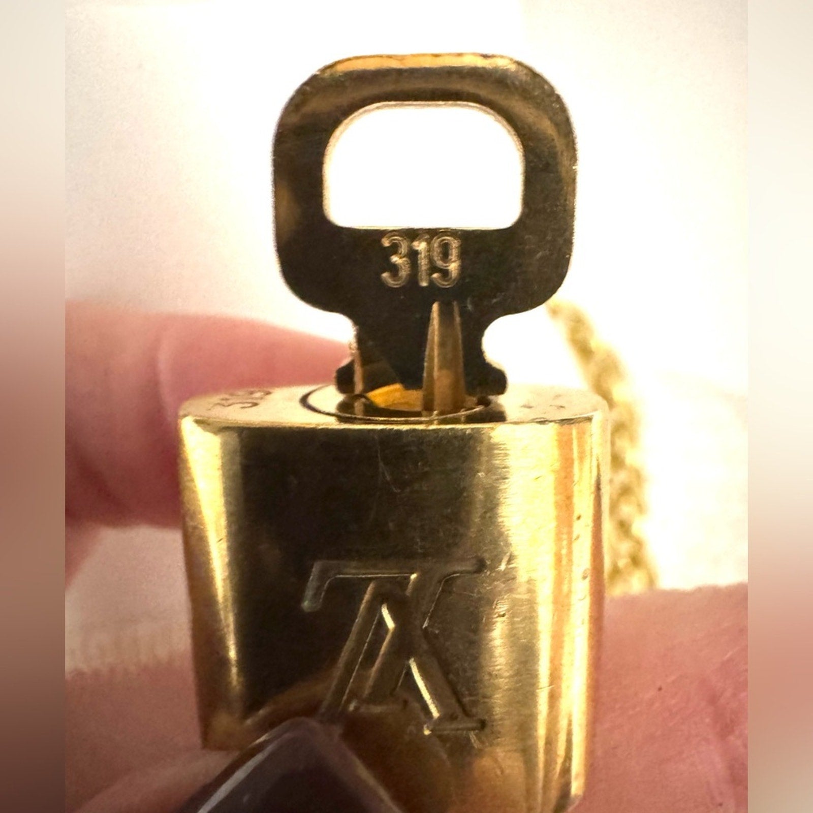 Louis Vuitton Gold Padlock #319 with LV branded chain that can be purse chain