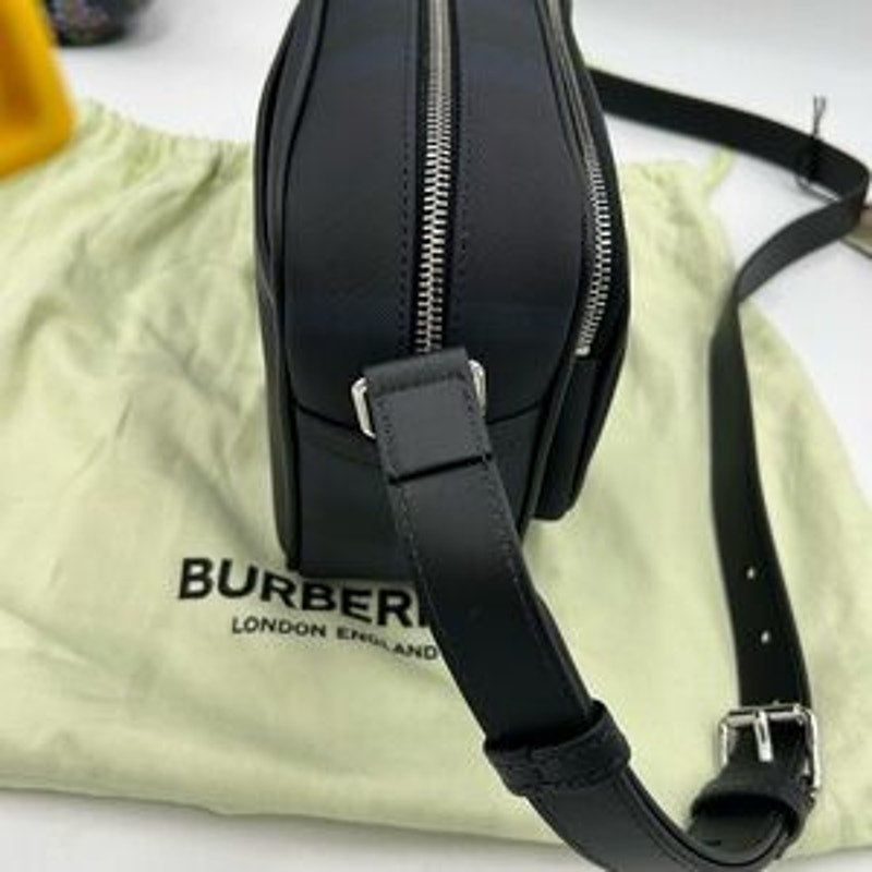 Men's Burberry, check messenger bag in navy blue. Adjustable shoulder strap.