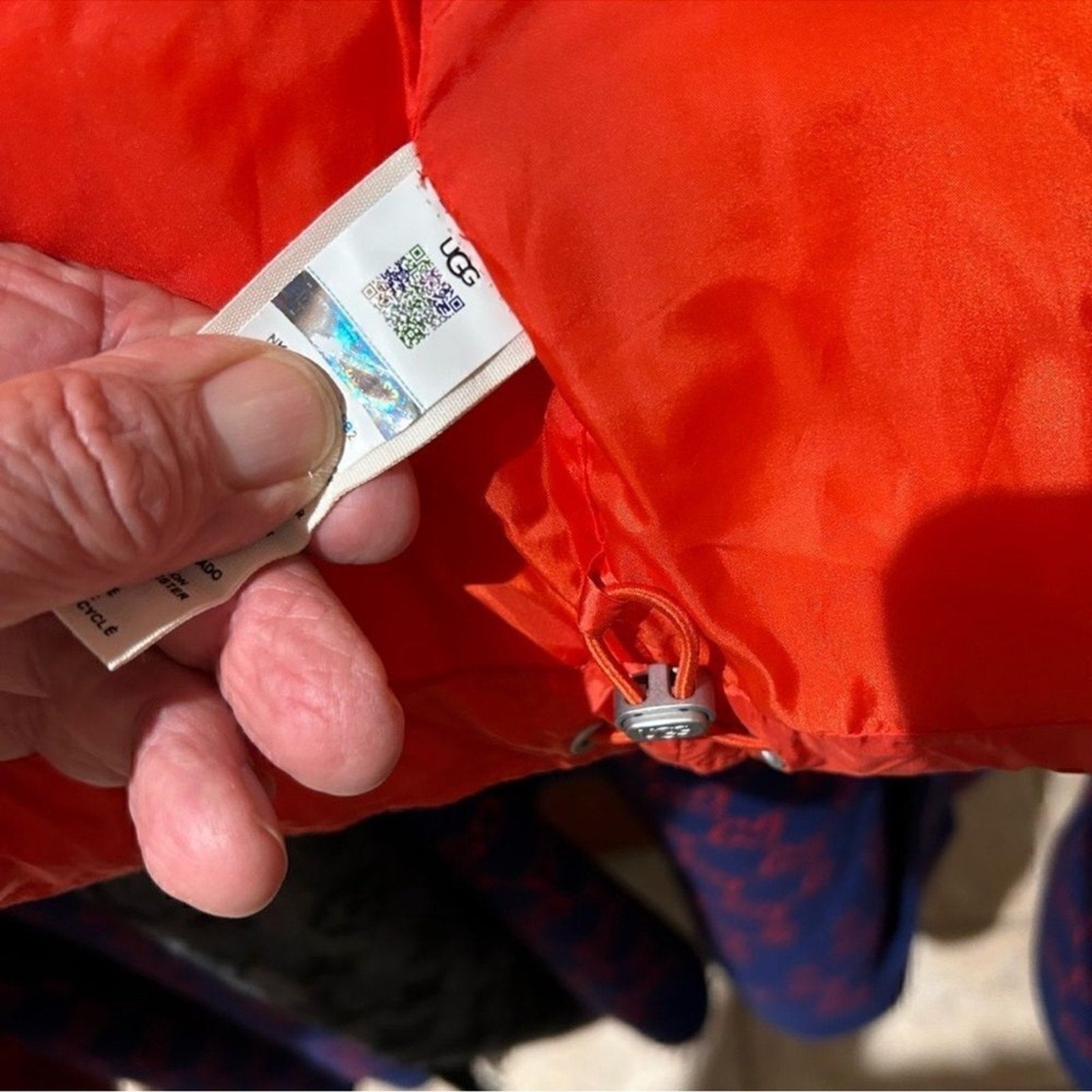 Women's UGG water resistant red puffer jacket, size Large
New With Tags