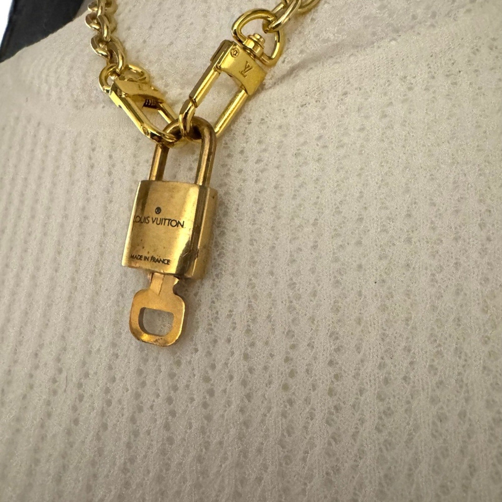 Louis Vuitton Gold Padlock #319 with LV branded chain that can be purse chain