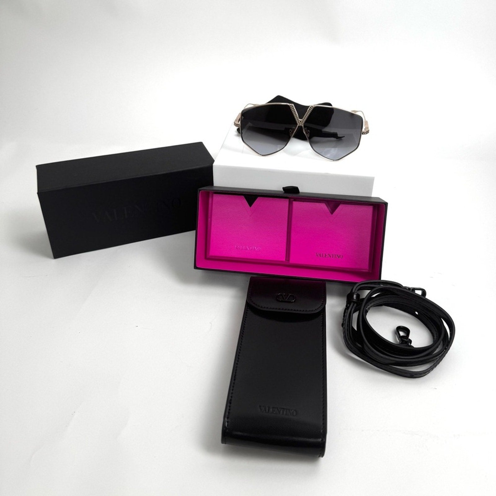 VALENTINO GARAVANI
V-Hexagon Titanium Sunglasses
Branded/crossbody bag included