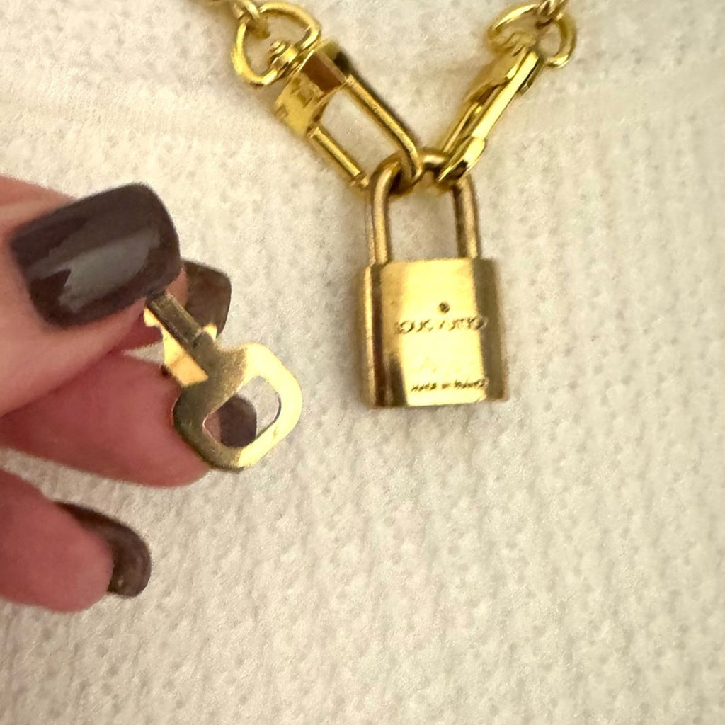 Louis Vuitton Gold Padlock #319 with LV branded chain that can be purse chain
