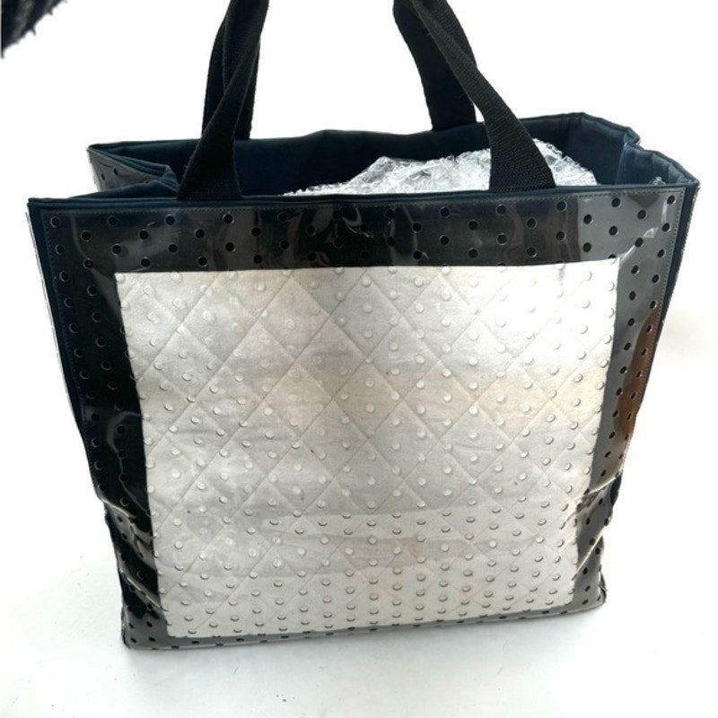 Chanel ENORMOUS tote, black + white fabric w/perforated pvc layer over material