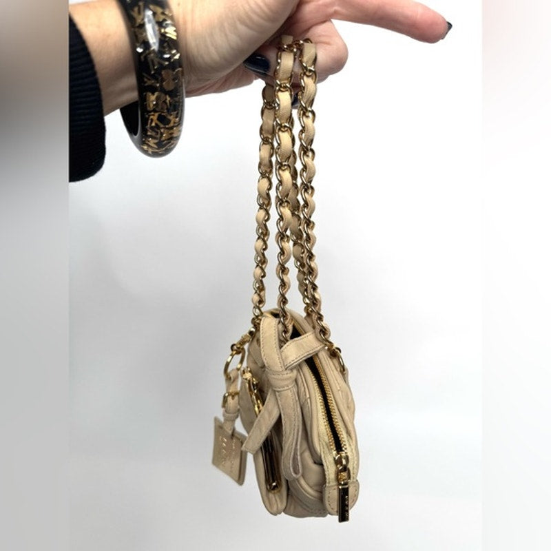 Dolce and Gabbana miniature leather bag with kiss lock, plaque and gold hardware