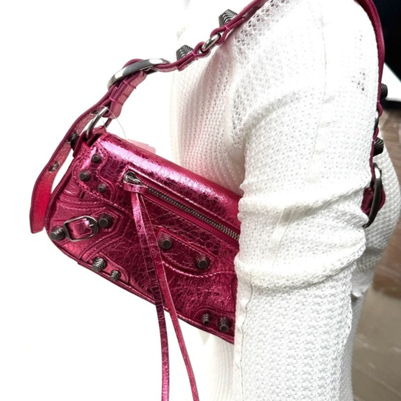 Balenciaga Metallic Agneau Arena Le Cagole Sling Bag XS in Pink. NWT’s & Dusty