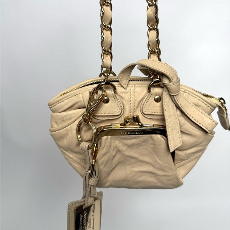 Dolce and Gabbana miniature leather bag with kiss lock, plaque and gold hardware