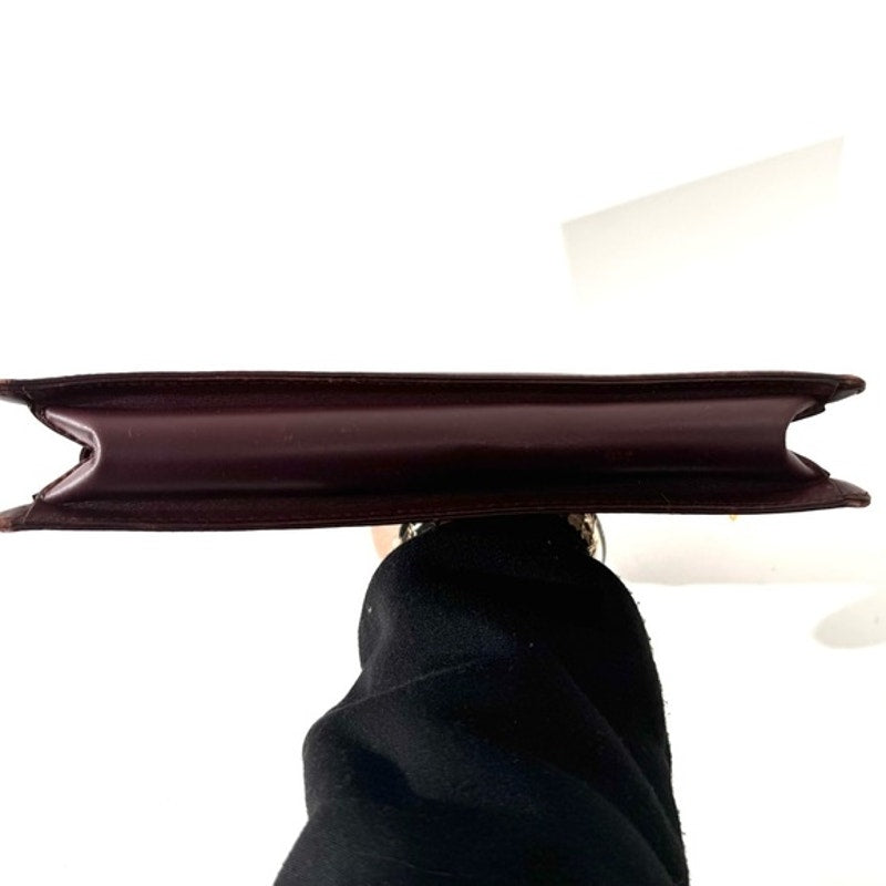 Cartier Burgundy Wristlet pouch with exterior front pocket w/interior peeling