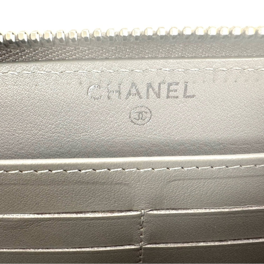 Women’s Chanel zip around long wallet, gray quilted pattern ombre holo present