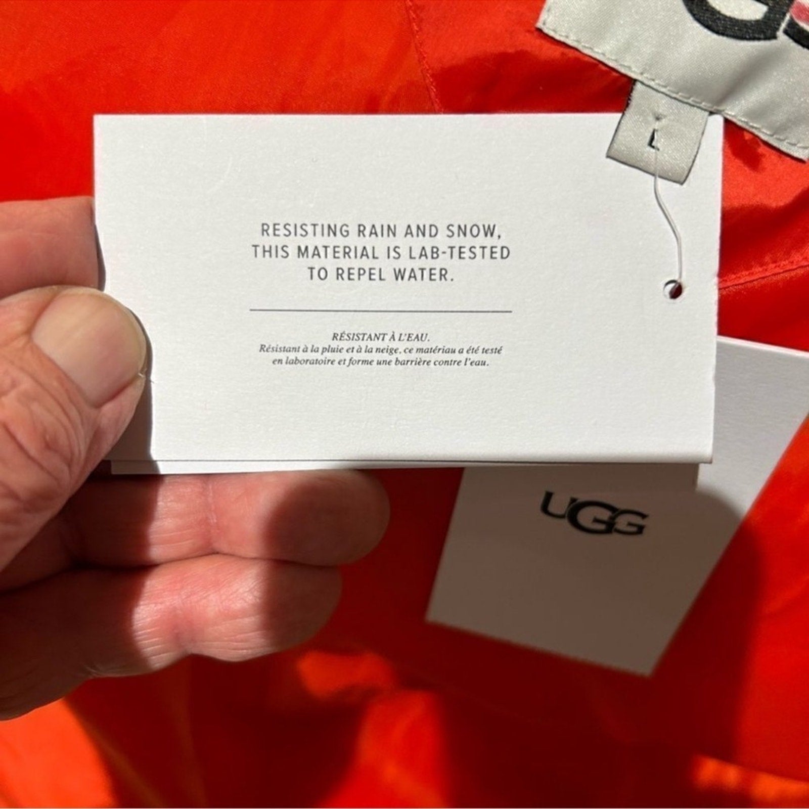 Women's UGG water resistant red puffer jacket, size Large
New With Tags