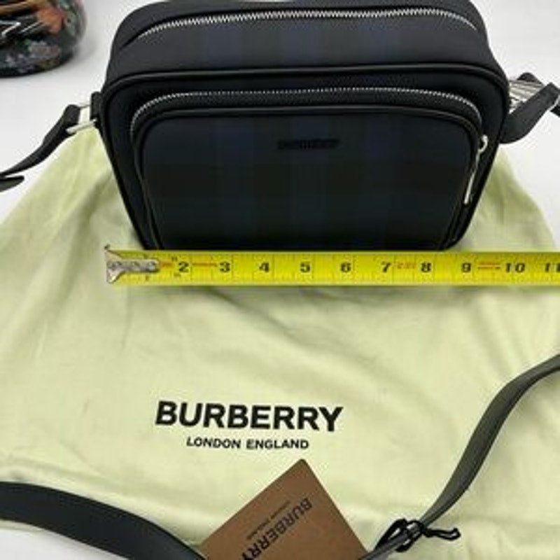 Men's Burberry, check messenger bag in navy blue. Adjustable shoulder strap.