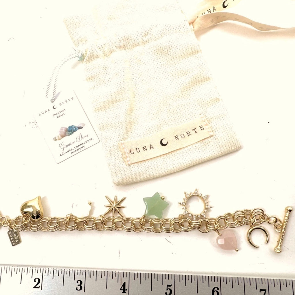 LUNA NORTE gold tone toggle charm bracelet. Semi-precious stones