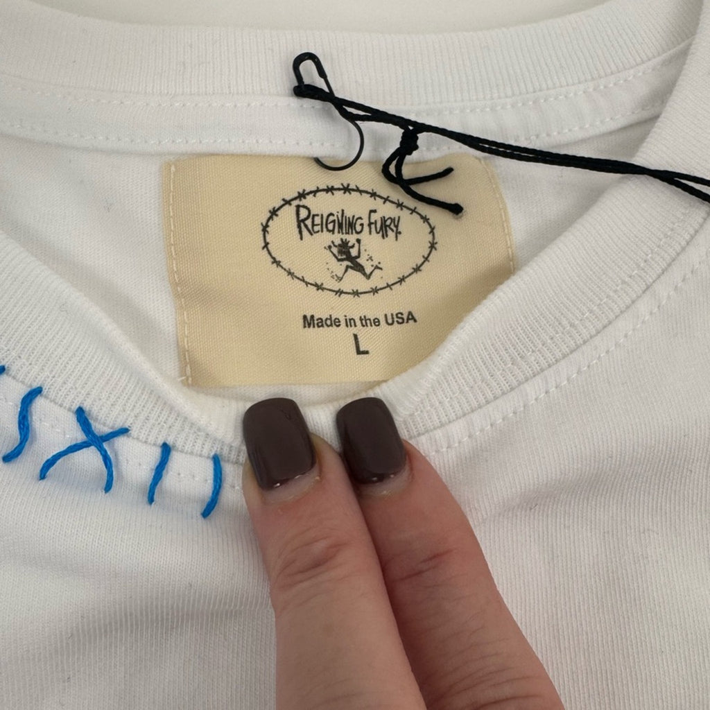 Men’s Reigning Fury-Blue Ghost of Trucker T White
Size L, limited edition NWT’s