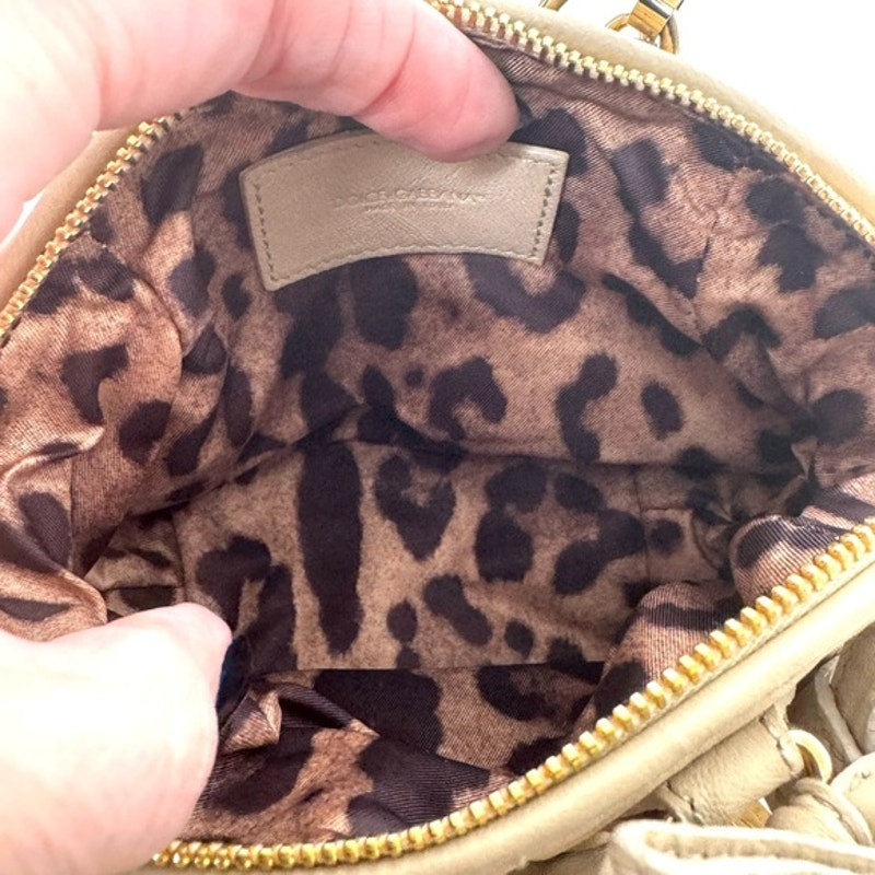 Dolce and Gabbana miniature leather bag with kiss lock, plaque and gold hardware