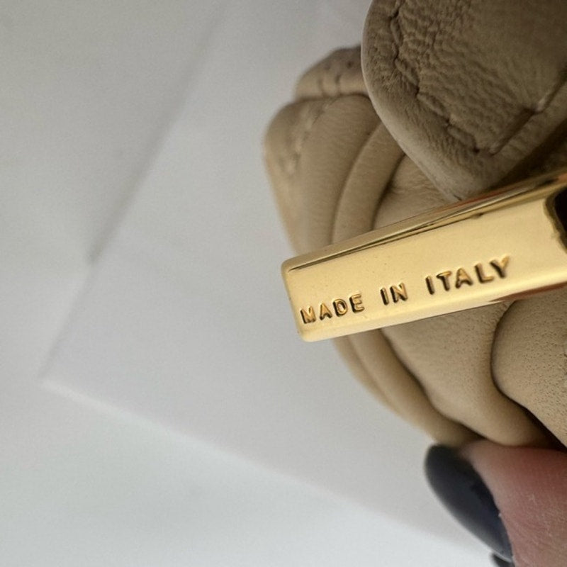 Dolce and Gabbana miniature leather bag with kiss lock, plaque and gold hardware