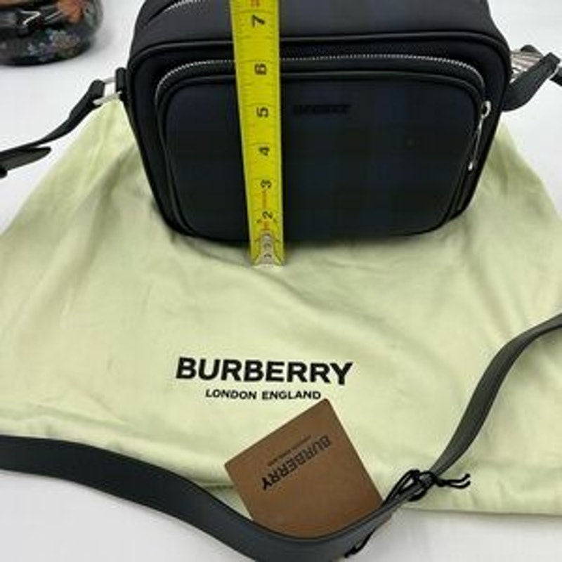 Men's Burberry, check messenger bag in navy blue. Adjustable shoulder strap.