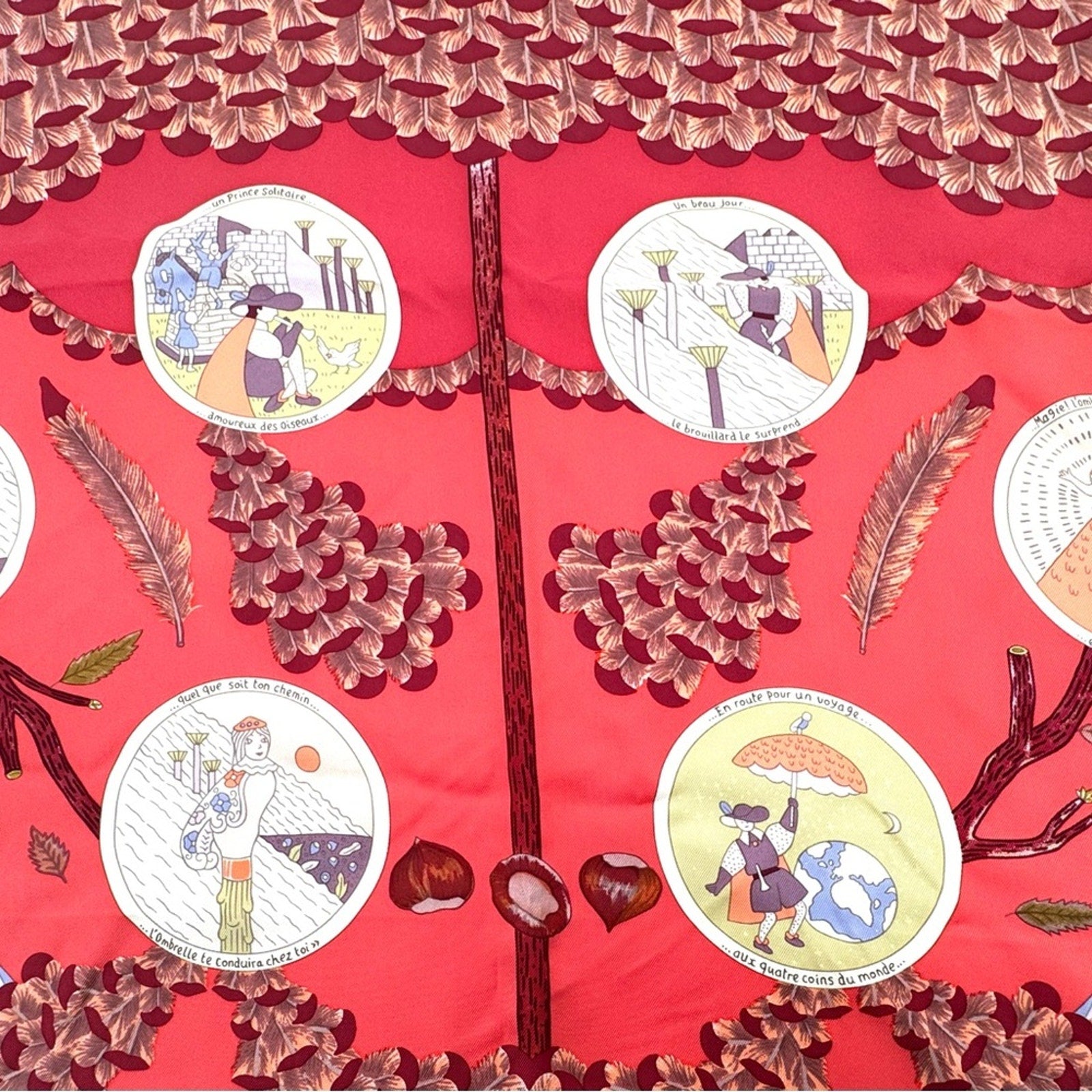 Hermes, silk scarf. The theme is the magic umbrella, coral colorway w/vignettes.