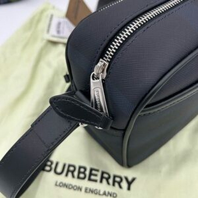 Men's Burberry, check messenger bag in navy blue. Adjustable shoulder strap.