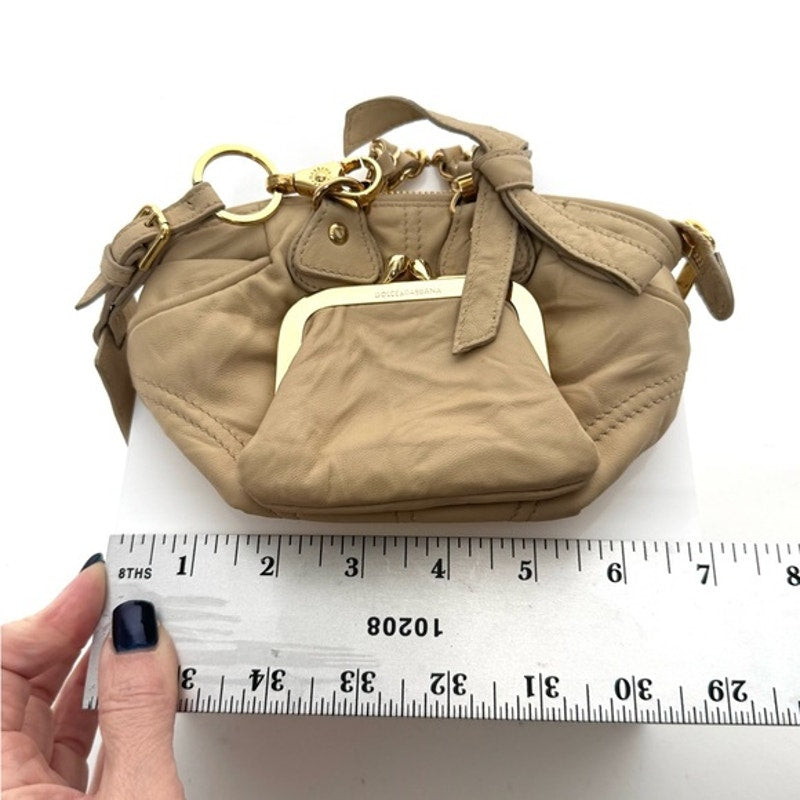 Dolce and Gabbana miniature leather bag with kiss lock, plaque and gold hardware