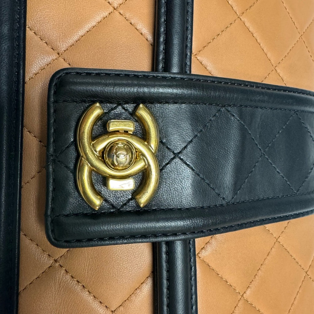 Chanel Black and Tan flap bag with gold hardware/adjustable strap/back pocket
