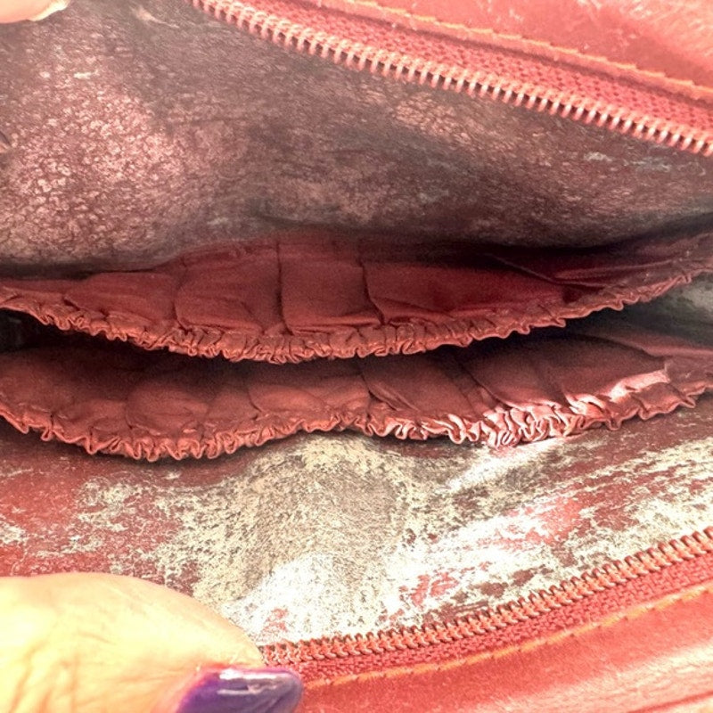 Cartier Burgundy Wristlet pouch with exterior front pocket w/interior peeling