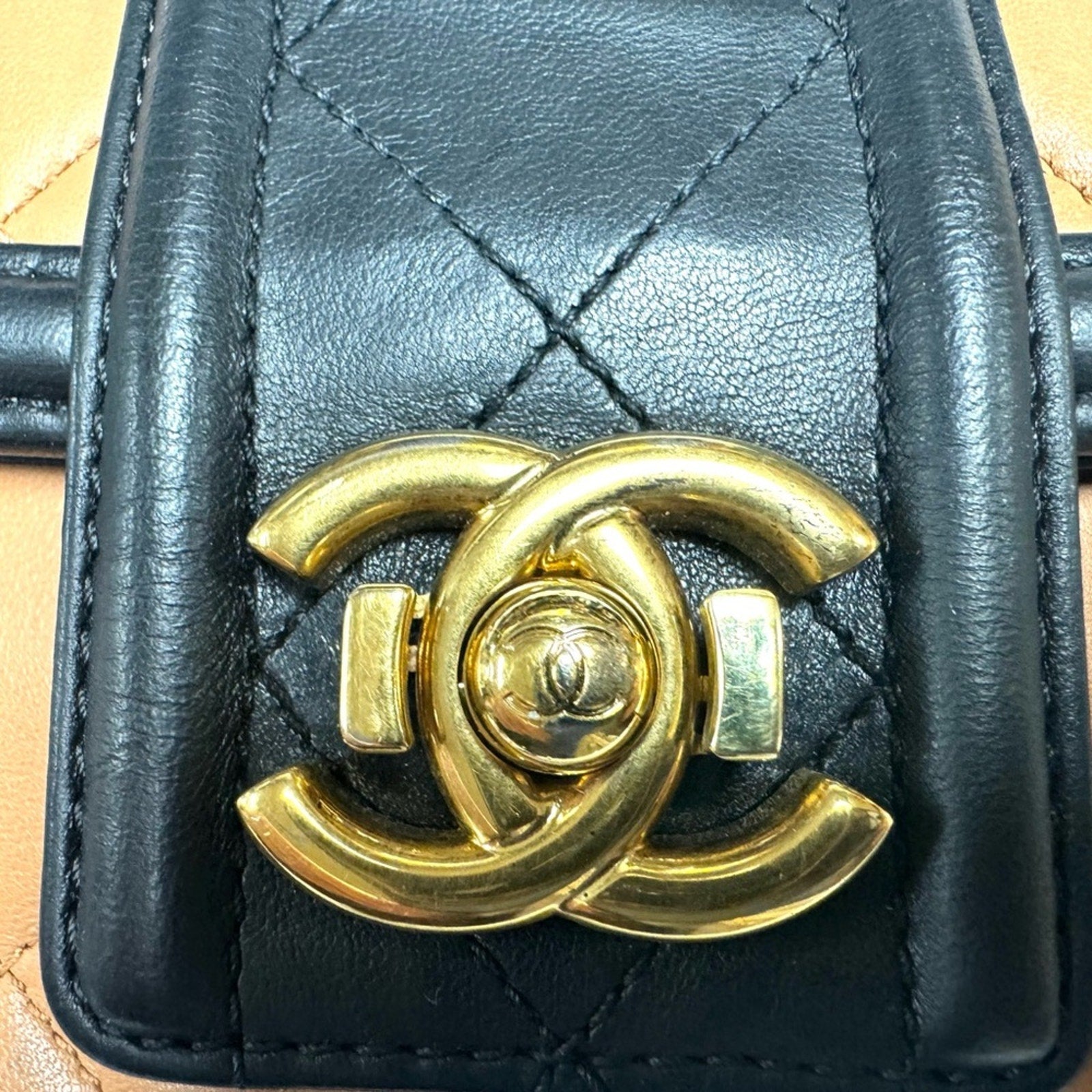 Chanel Black and Tan flap bag with gold hardware/adjustable strap/back pocket