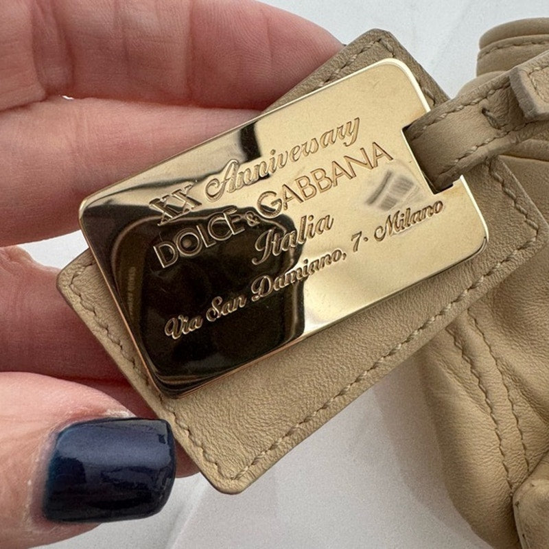 Dolce and Gabbana miniature leather bag with kiss lock, plaque and gold hardware