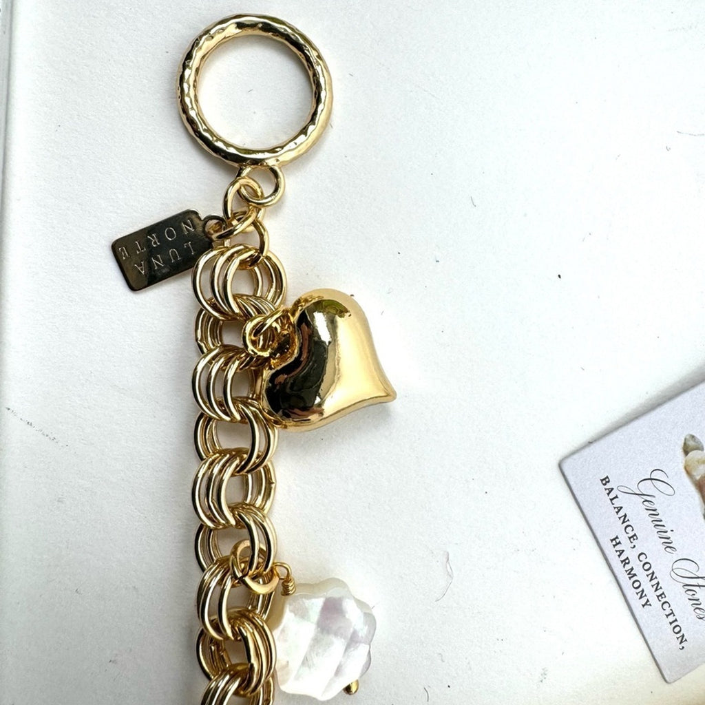LUNA NORTE gold tone toggle charm bracelet. Semi-precious stones