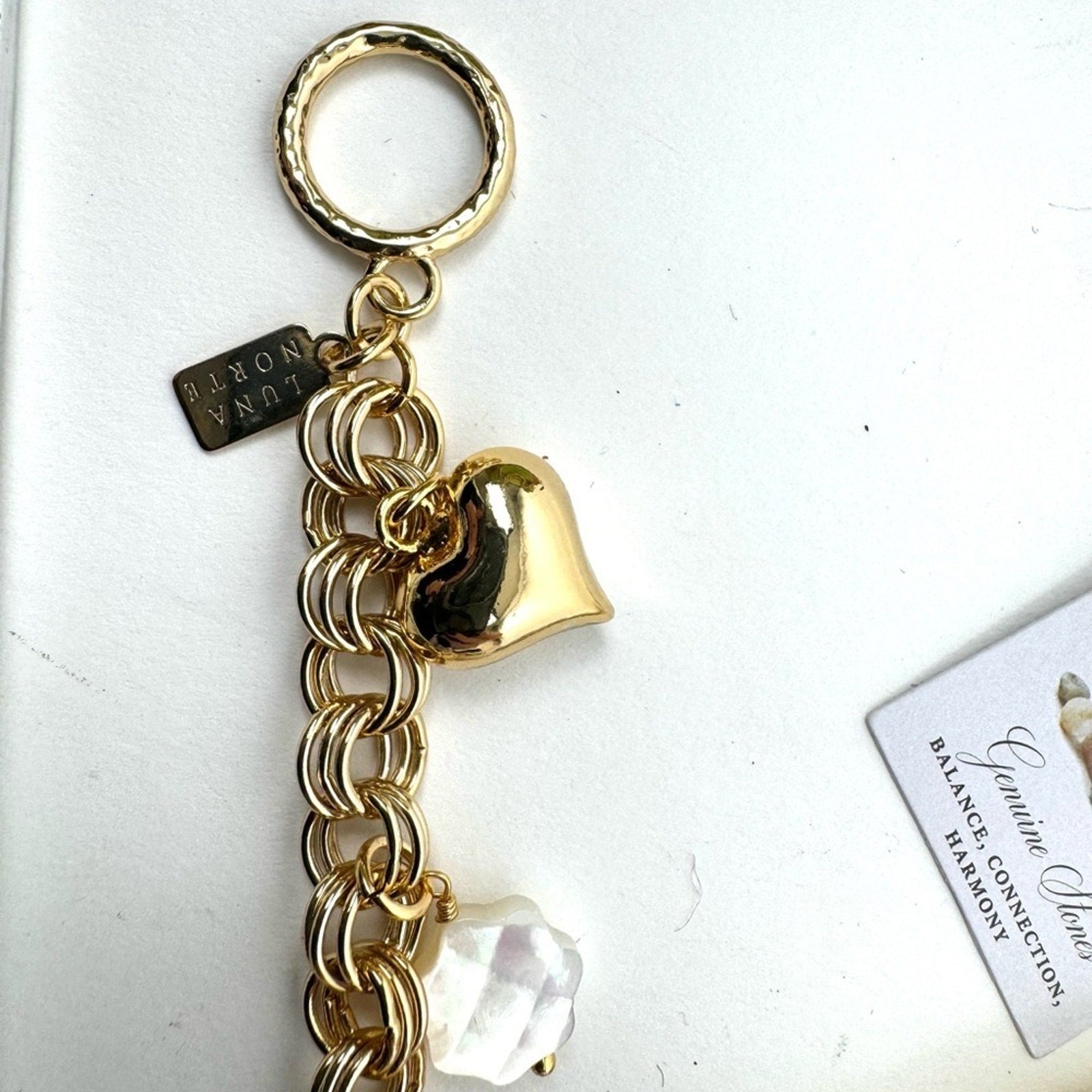 LUNA NORTE gold tone toggle charm bracelet. Semi-precious stones