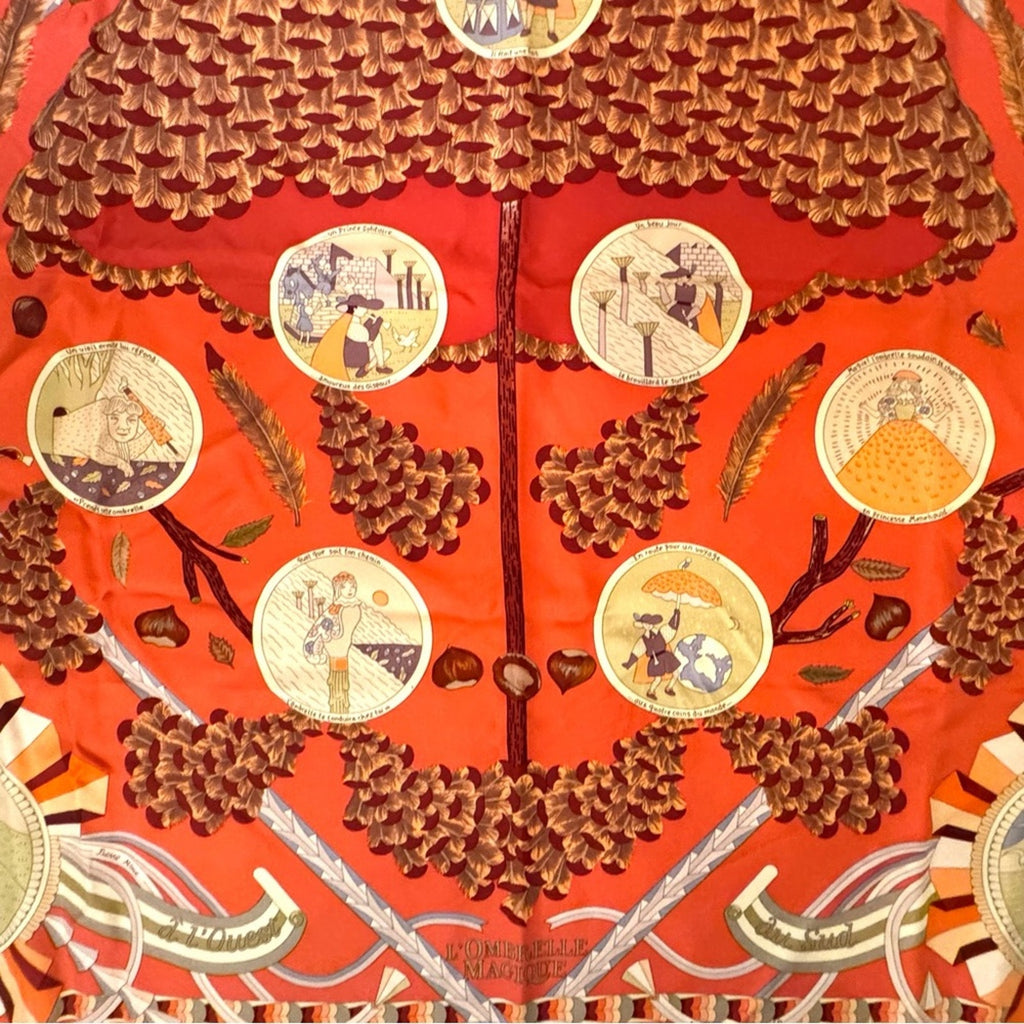 Hermes, silk scarf. The theme is the magic umbrella, coral colorway w/vignettes.