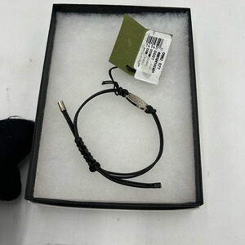 Gucci, black leather cord bracelet with sterling silver logo engraved plaque