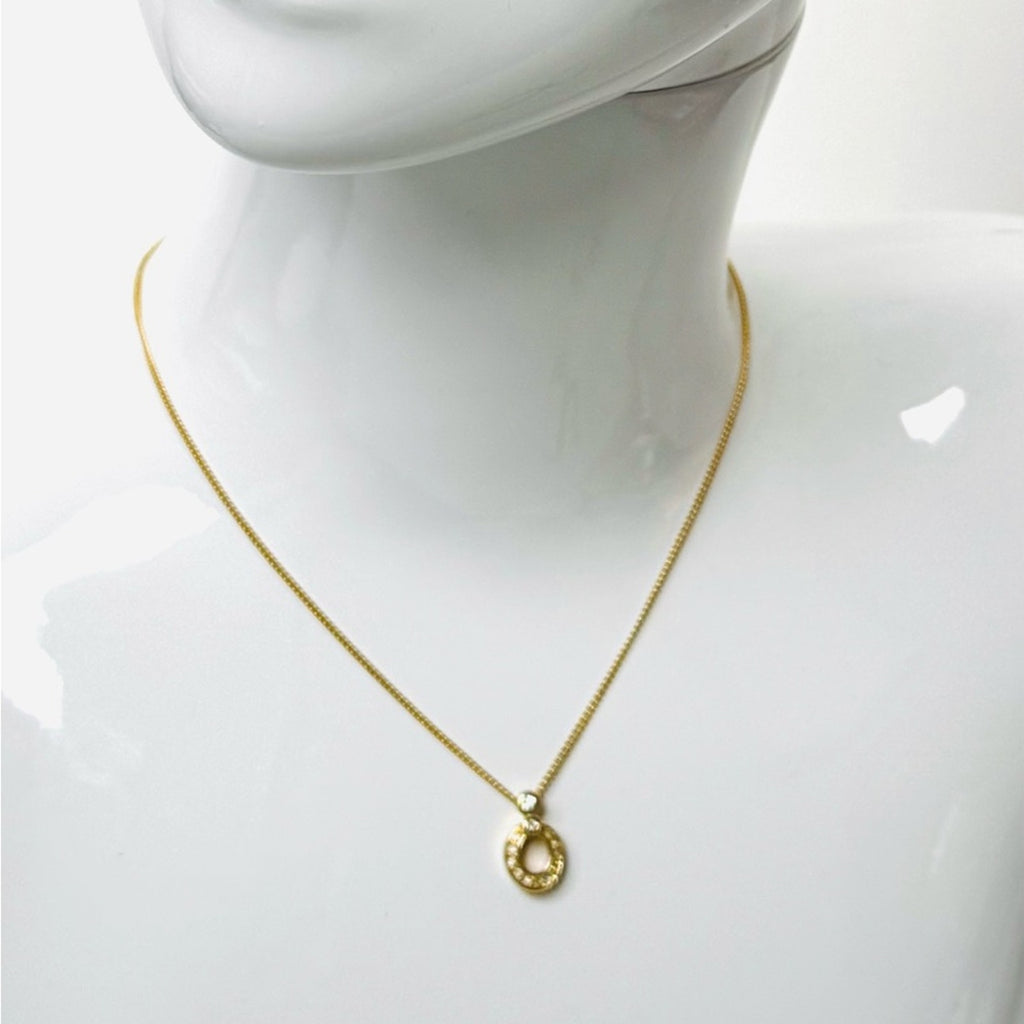 Christian Dior pendant necklace adorned with rhinestones CD clasp