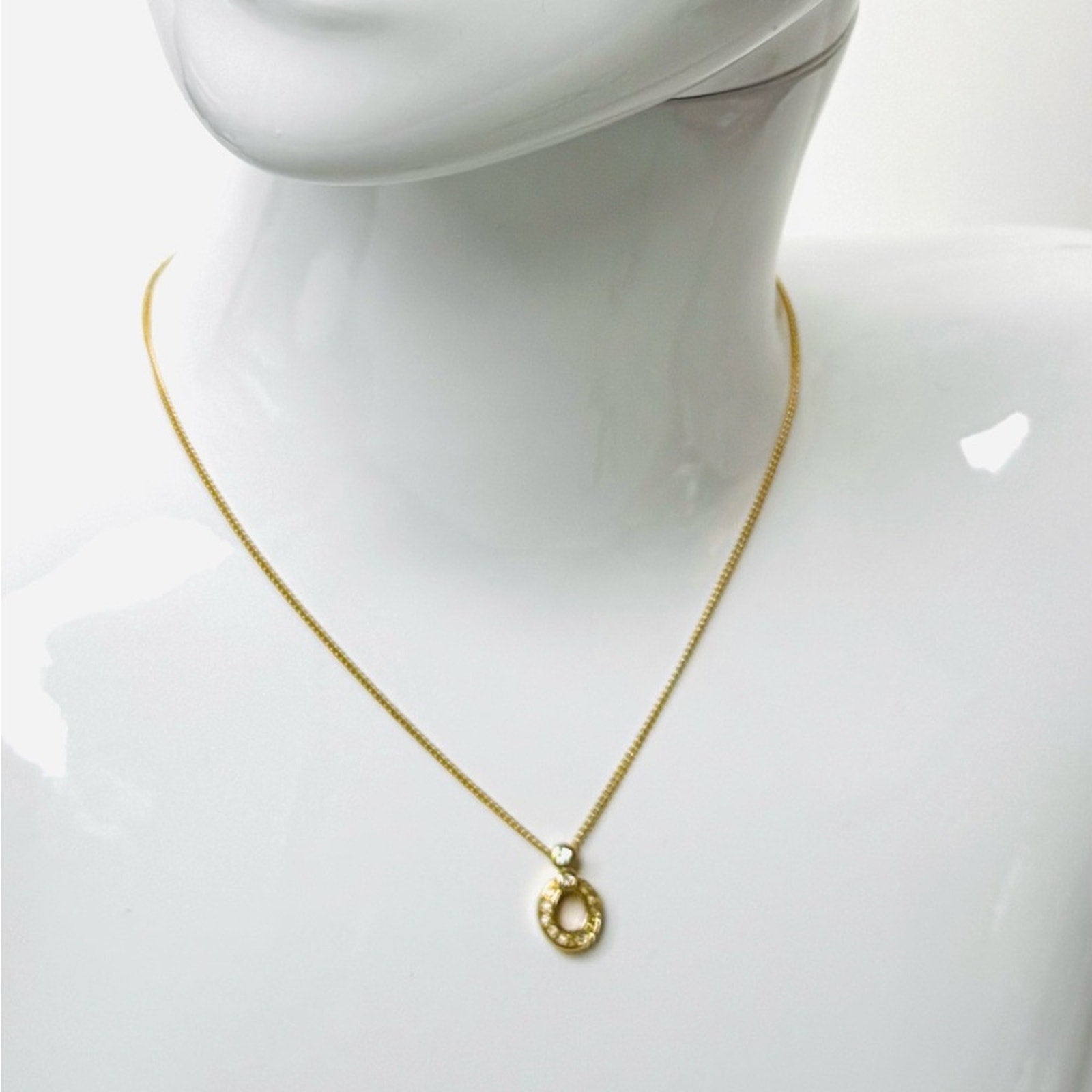 Christian Dior pendant necklace adorned with rhinestones CD clasp