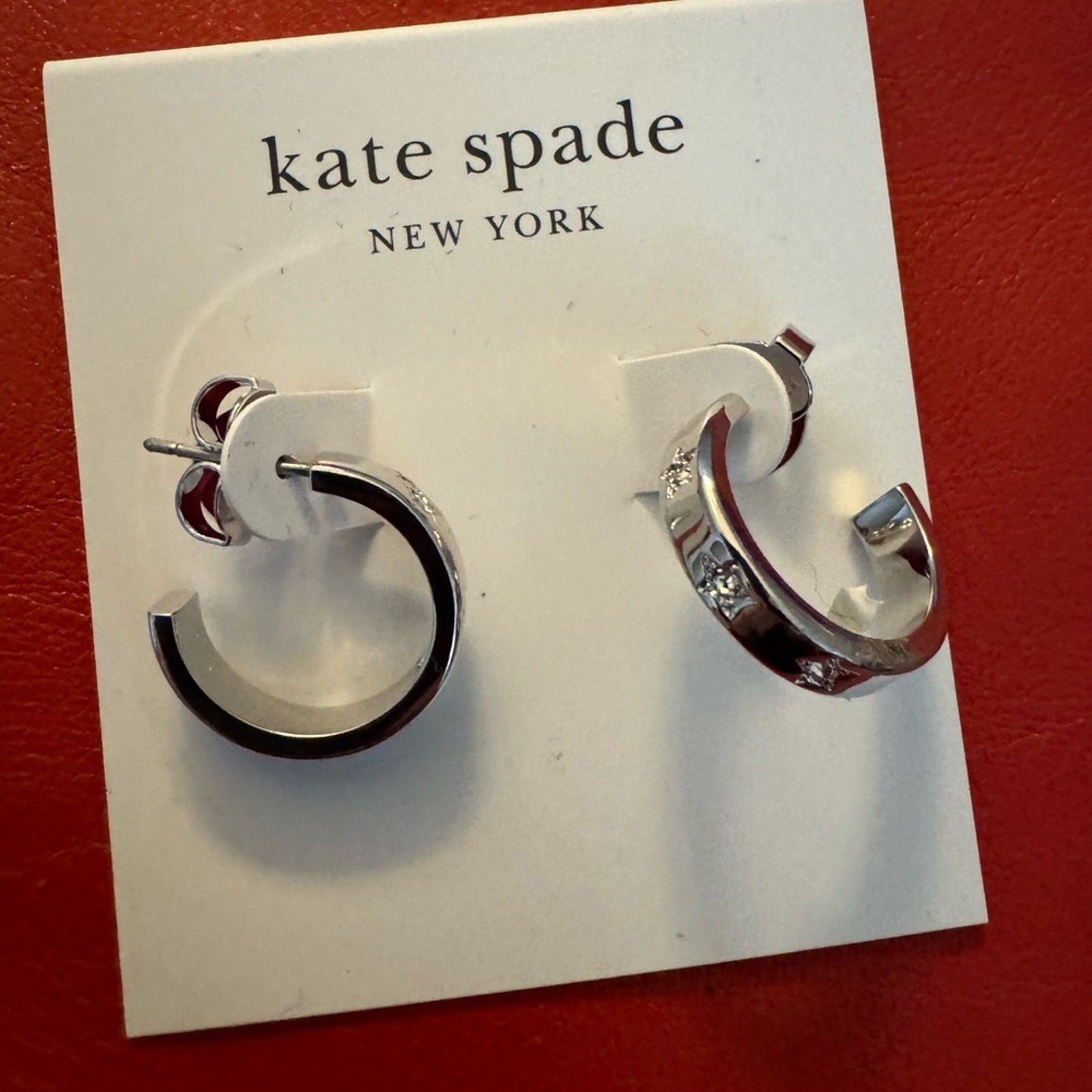 Kate Spade NWT’s silver toned post hoops with rhinestone star detail
