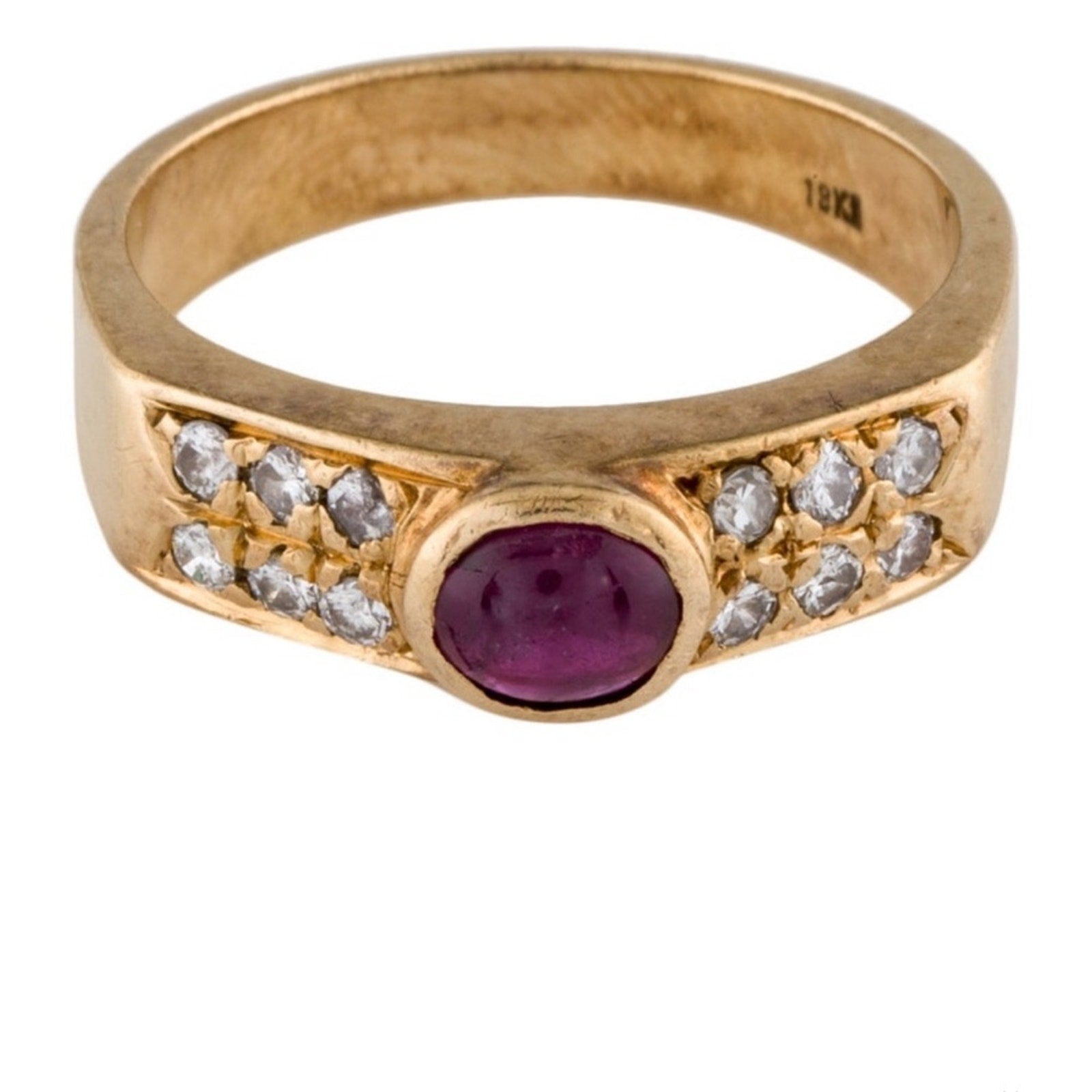 Cabochon Ruby ring set with diamond stones set in an 18 karat gold band