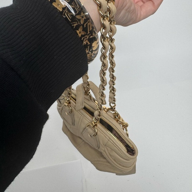 Dolce and Gabbana miniature leather bag with kiss lock, plaque and gold hardware