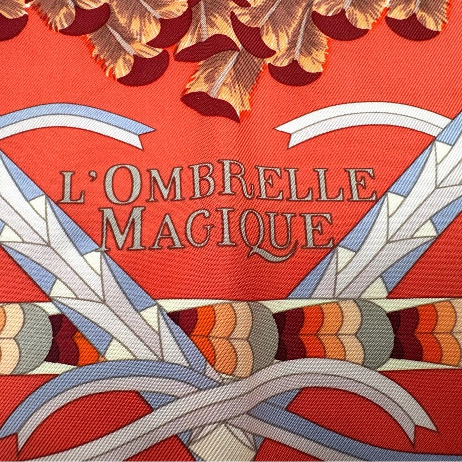 Hermes, silk scarf. The theme is the magic umbrella, coral colorway w/vignettes.