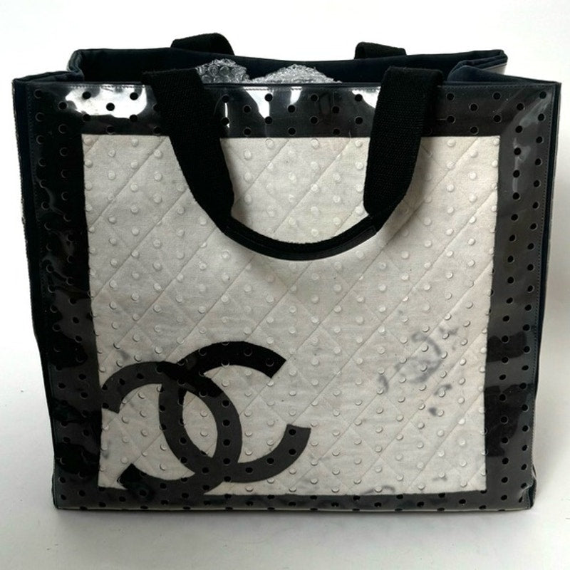 Chanel ENORMOUS tote, black + white fabric w/perforated pvc layer over material