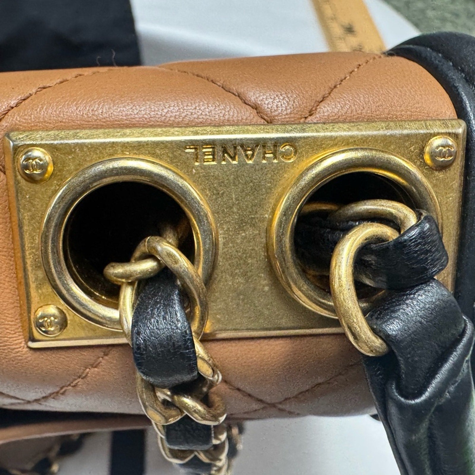 Chanel Black and Tan flap bag with gold hardware/adjustable strap/back pocket