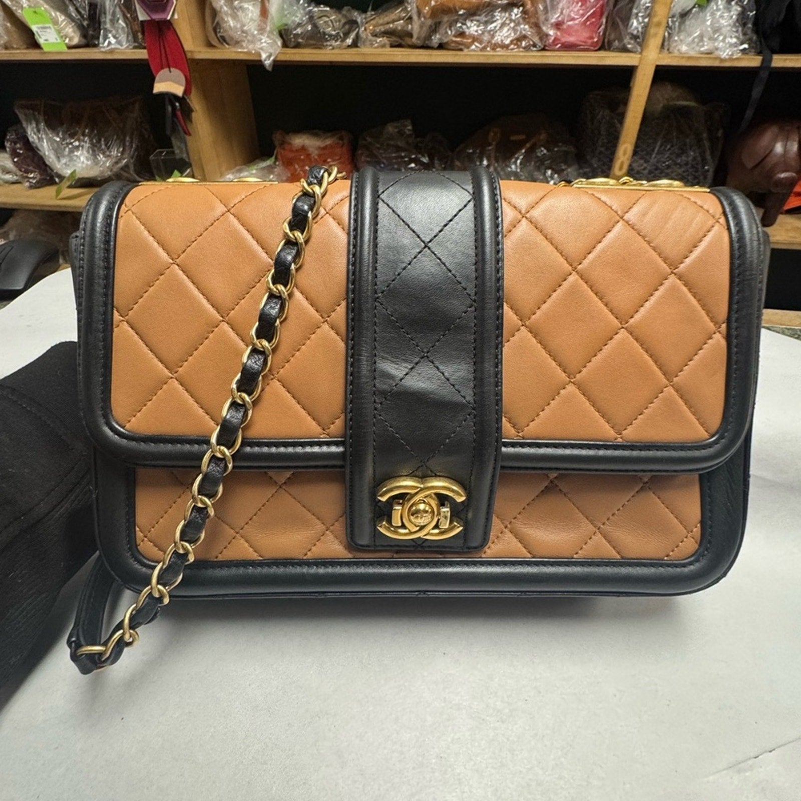 Chanel Black and Tan flap bag with gold hardware/adjustable strap/back pocket