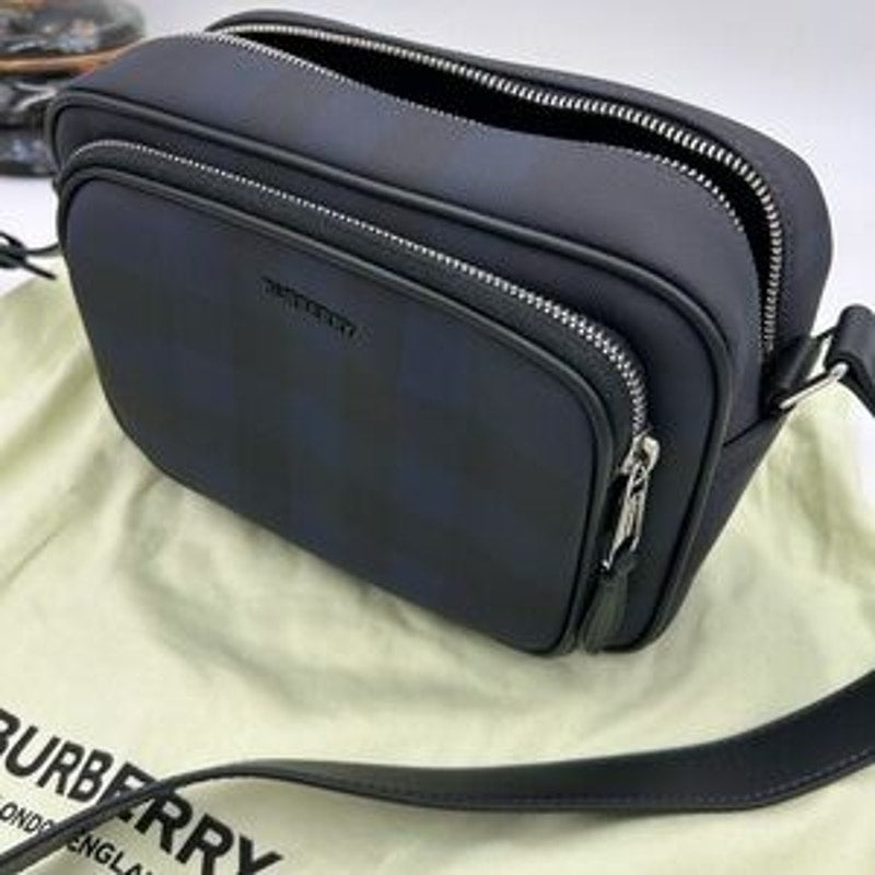 Men's Burberry, check messenger bag in navy blue. Adjustable shoulder strap.