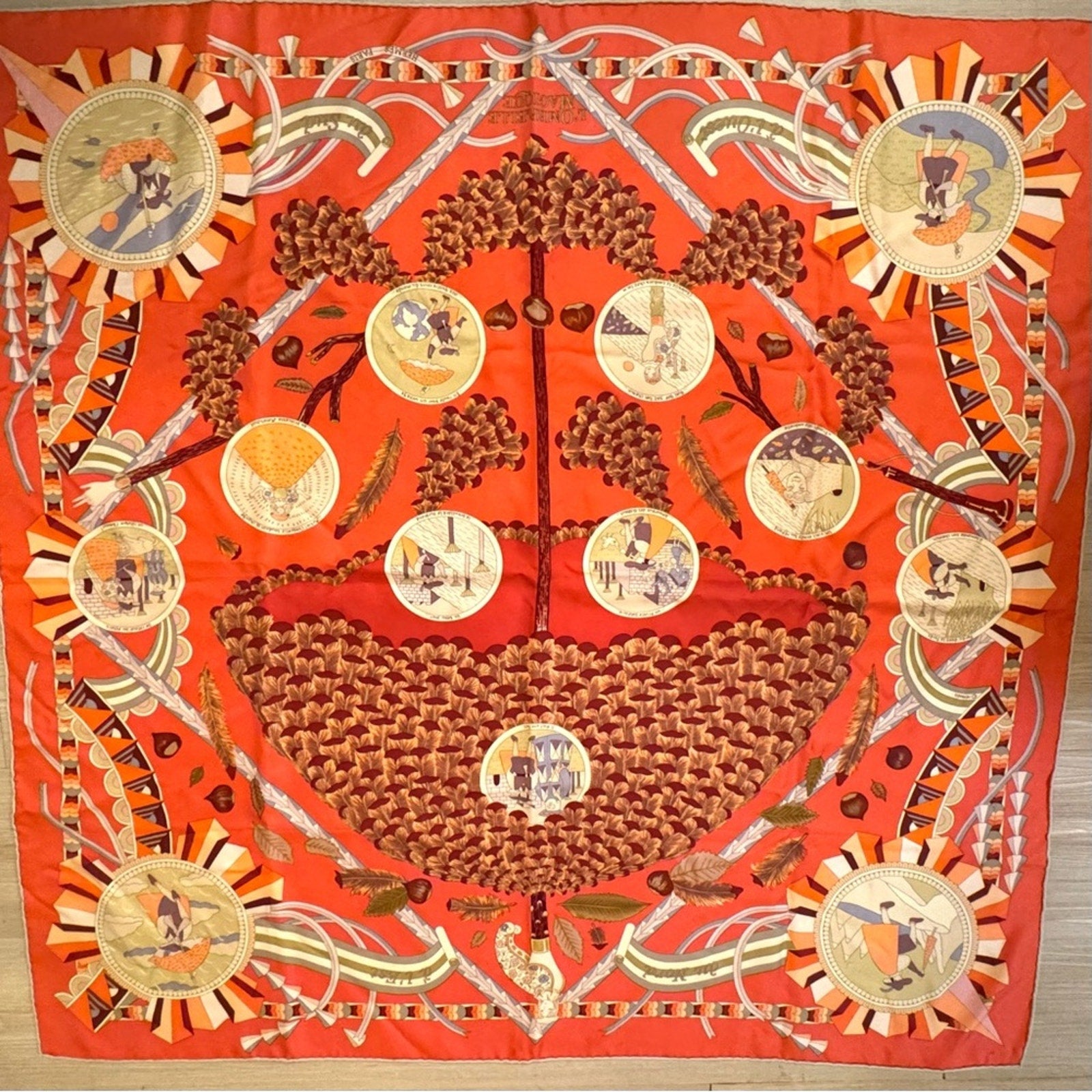 Hermes, silk scarf. The theme is the magic umbrella, coral colorway w/vignettes.