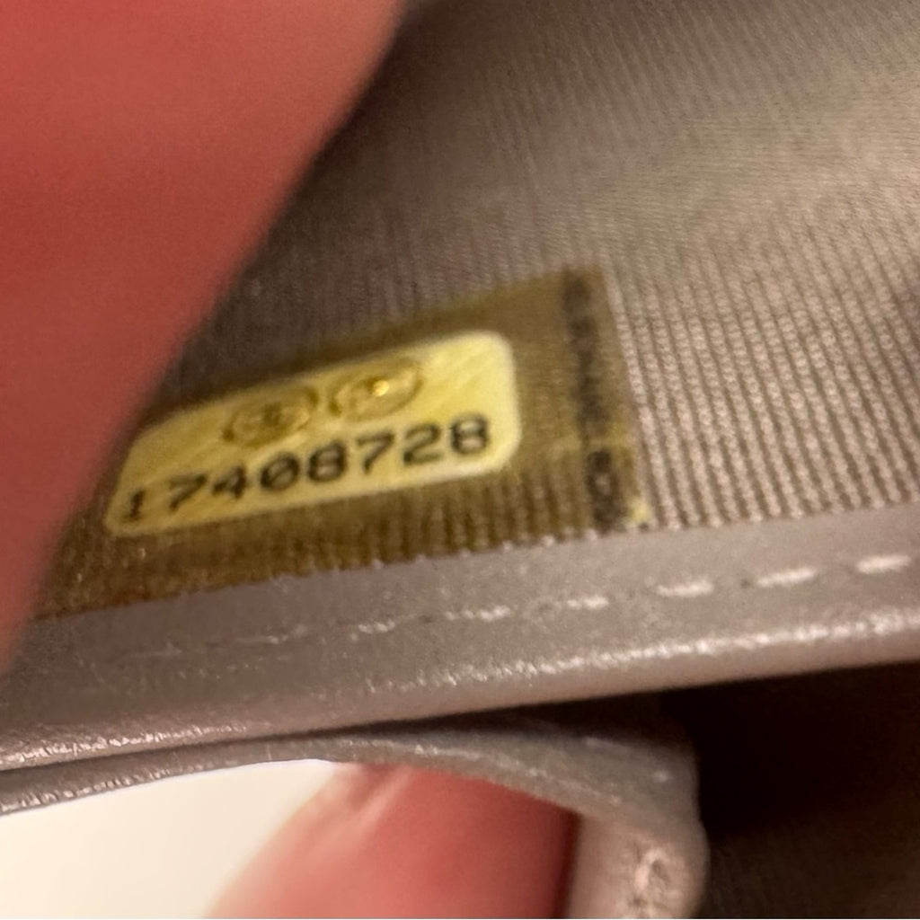 Women’s Chanel zip around long wallet, gray quilted pattern ombre holo present