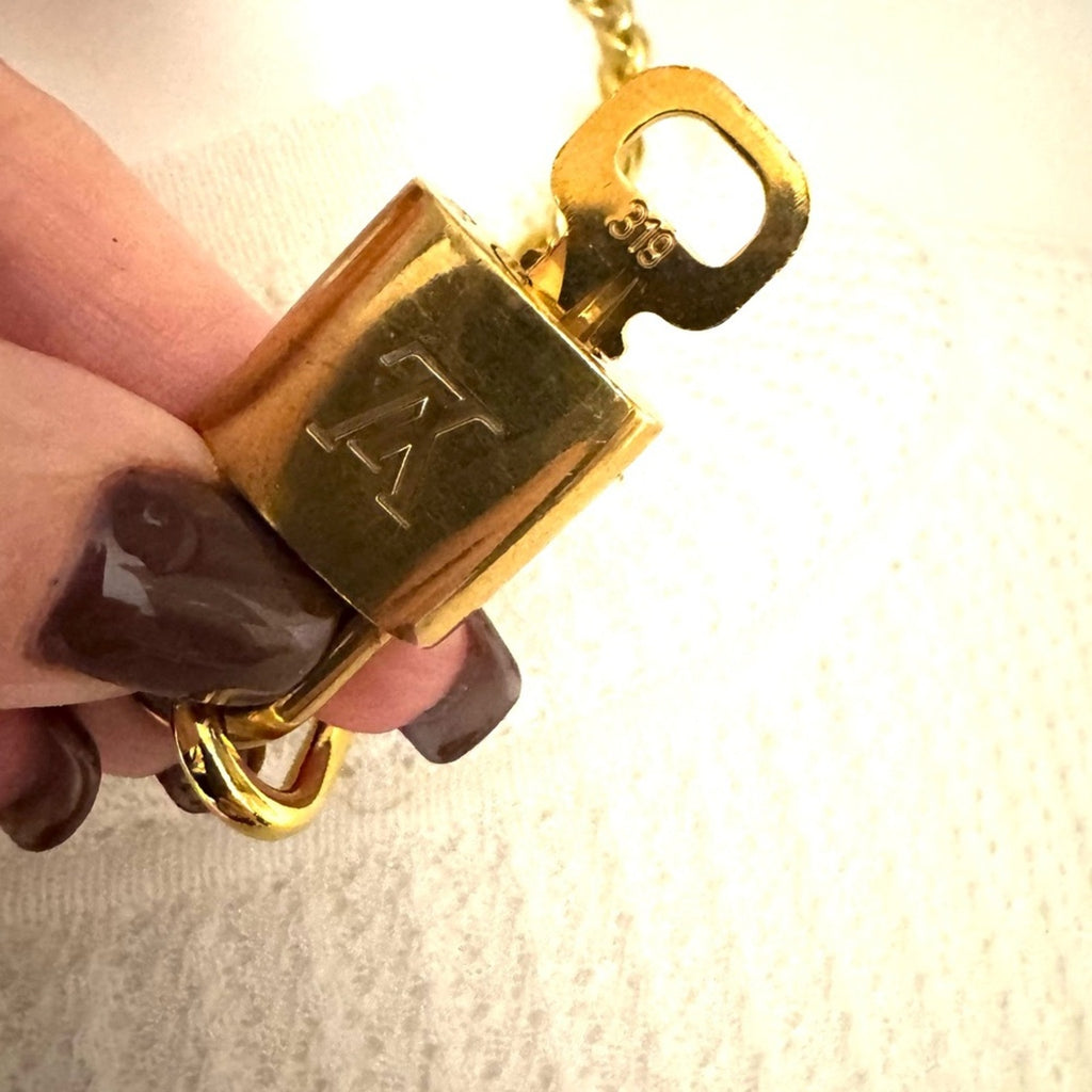 Louis Vuitton Gold Padlock #319 with LV branded chain that can be purse chain