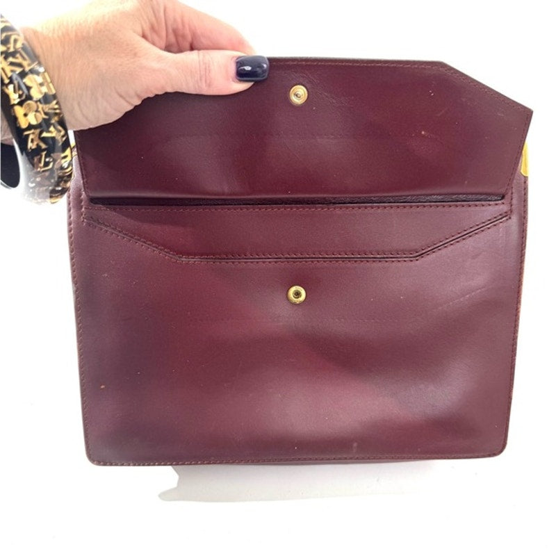 Cartier Burgundy Wristlet pouch with exterior front pocket w/interior peeling
