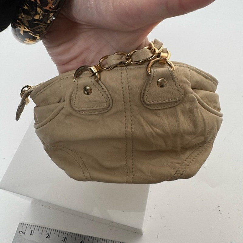 Dolce and Gabbana miniature leather bag with kiss lock, plaque and gold hardware